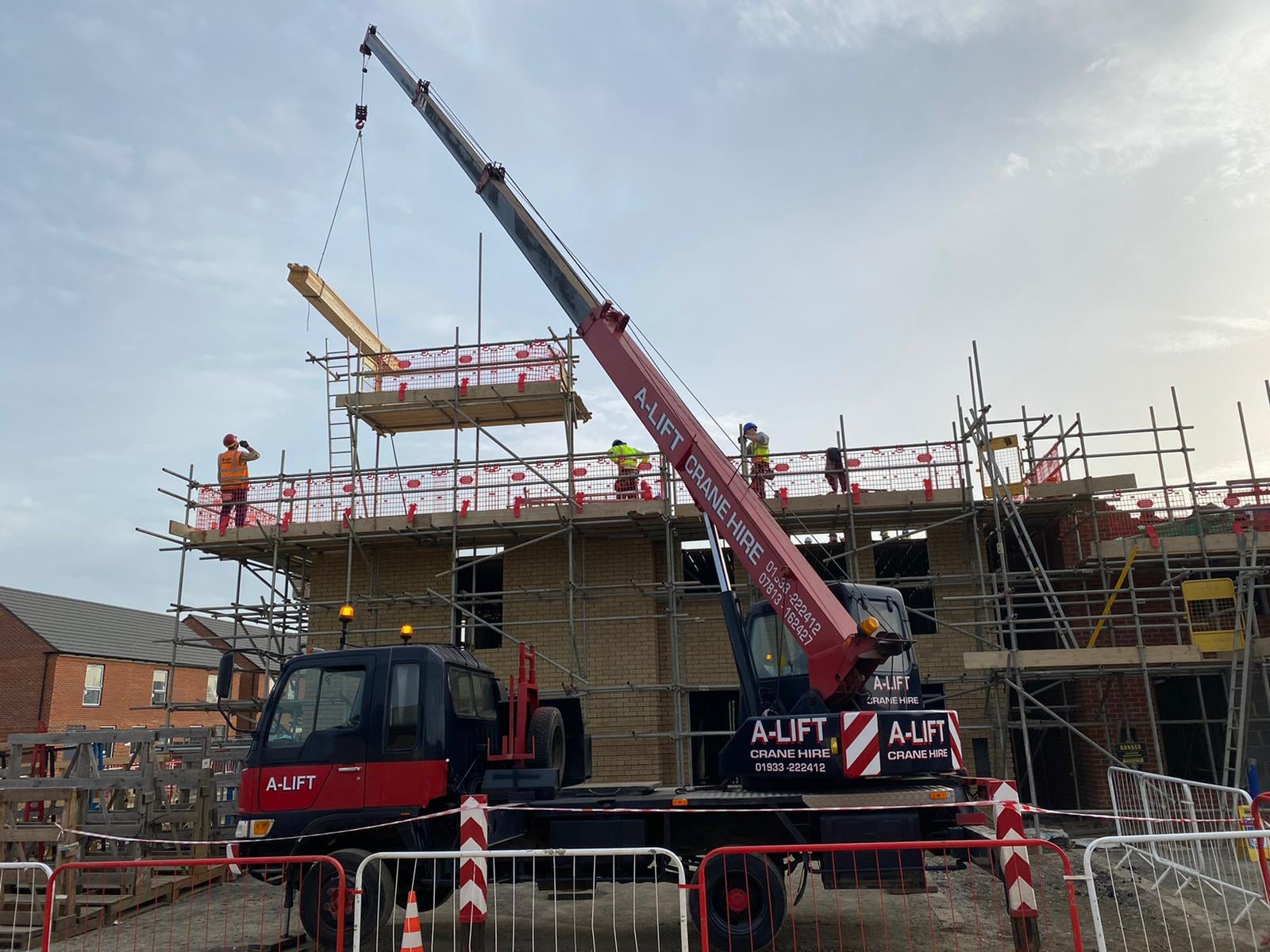 Crane Hire in Northampton lifting roof trusses for housing development company